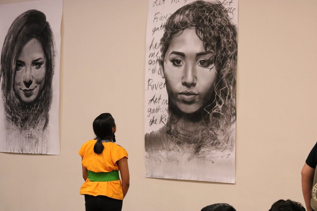 a woman looking at art
