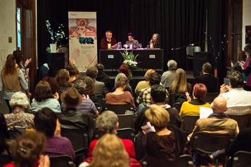 a panel discussion and a large audience
