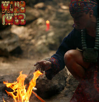Apab'yan Tew in front of a bonfire